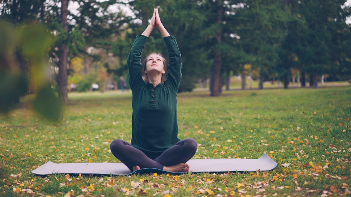 Yoga practitioner in warrior pose demonstrating strength building